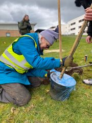 Image from the planting of The Dispersed Memorial Forest in The Crichton & NHS Mountainhall, Dumfries, Scotland.