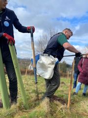 Image from the planting of The Dispersed Memorial Forest in The Crichton & NHS Mountainhall, Dumfries, Scotland.