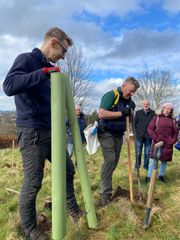 Image from the planting of The Dispersed Memorial Forest in The Crichton & NHS Mountainhall, Dumfries, Scotland.