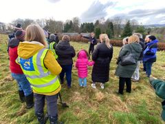 Image from the planting of The Dispersed Memorial Forest in The Crichton & NHS Mountainhall, Dumfries, Scotland.
